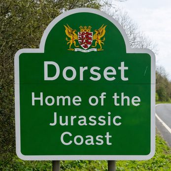 A Dorset county road sign reading Home of the Jurassic Coast.