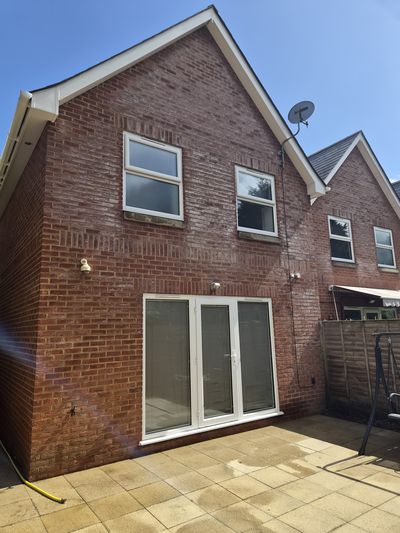 The same rear elevation after cleaning, glass and frames clear.