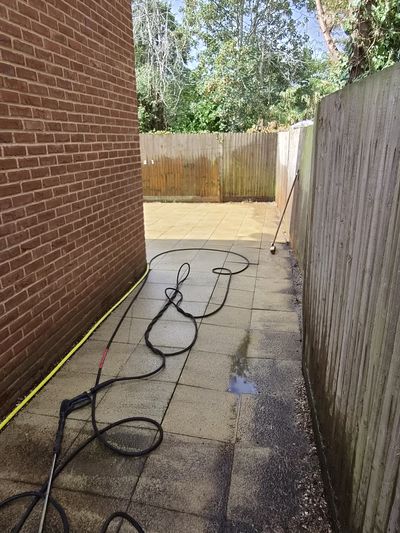 The path partway through cleaning with a clean strip down the middle.