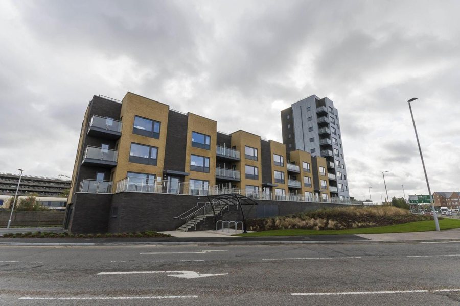Nile Court in Poole, a modern block of flats with balconies and a tower section.